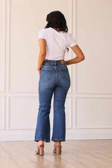 THE BLAKE MID WASHED MID RISE DISTRESSED CROP FLARE