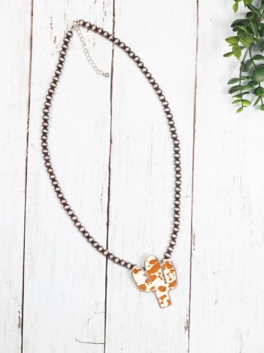 WANTED AND WILD LIGHT BROWN COWHIDE CACTUS PENDANT ON NAVAJO PEARLS